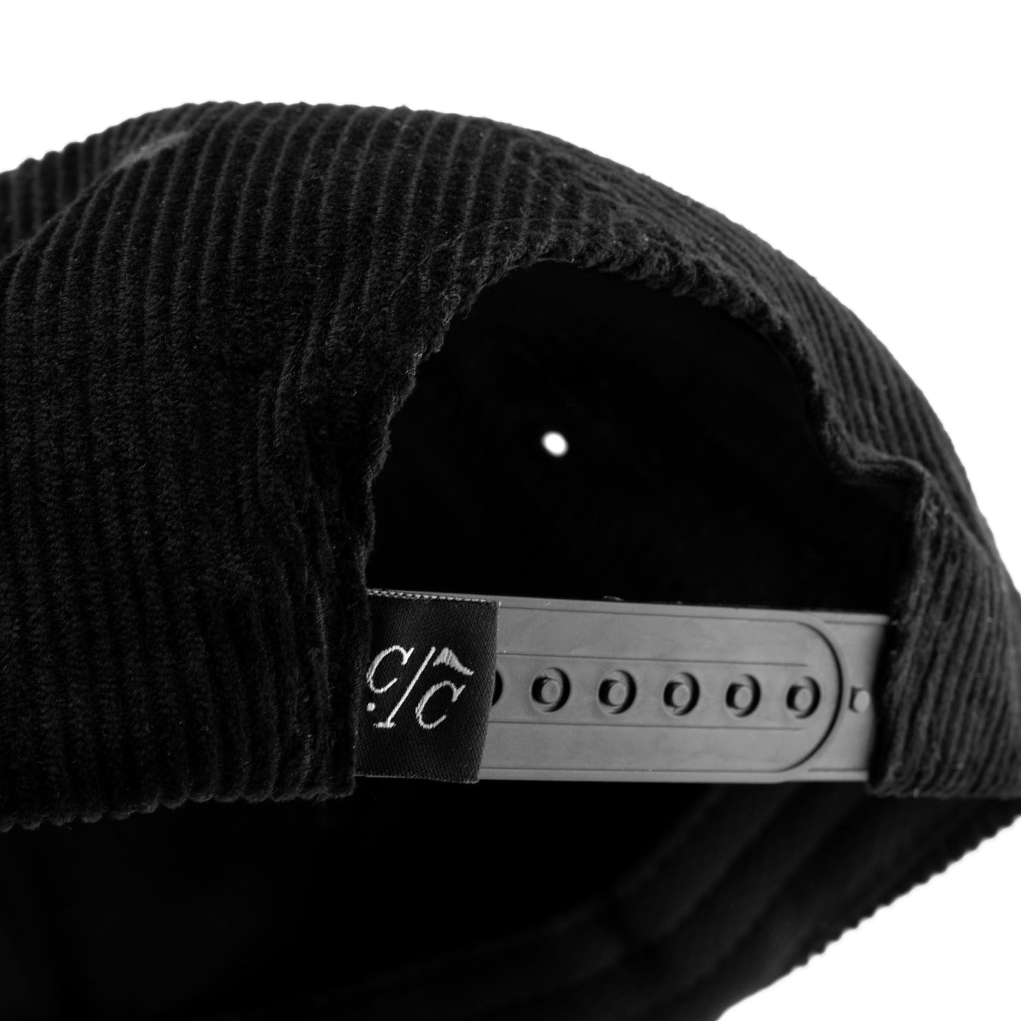 Caddy Classics black corduroy golf hat — back angle with CC tag