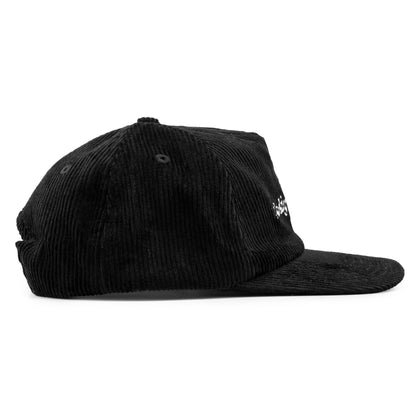 Black corduroy cap on a white background