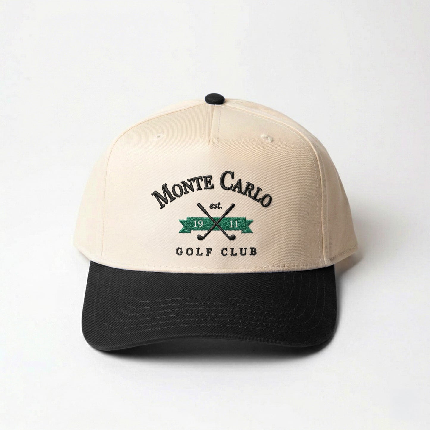 Monte Carlo Traditional golf hat in black — front view with embroidered-look crest