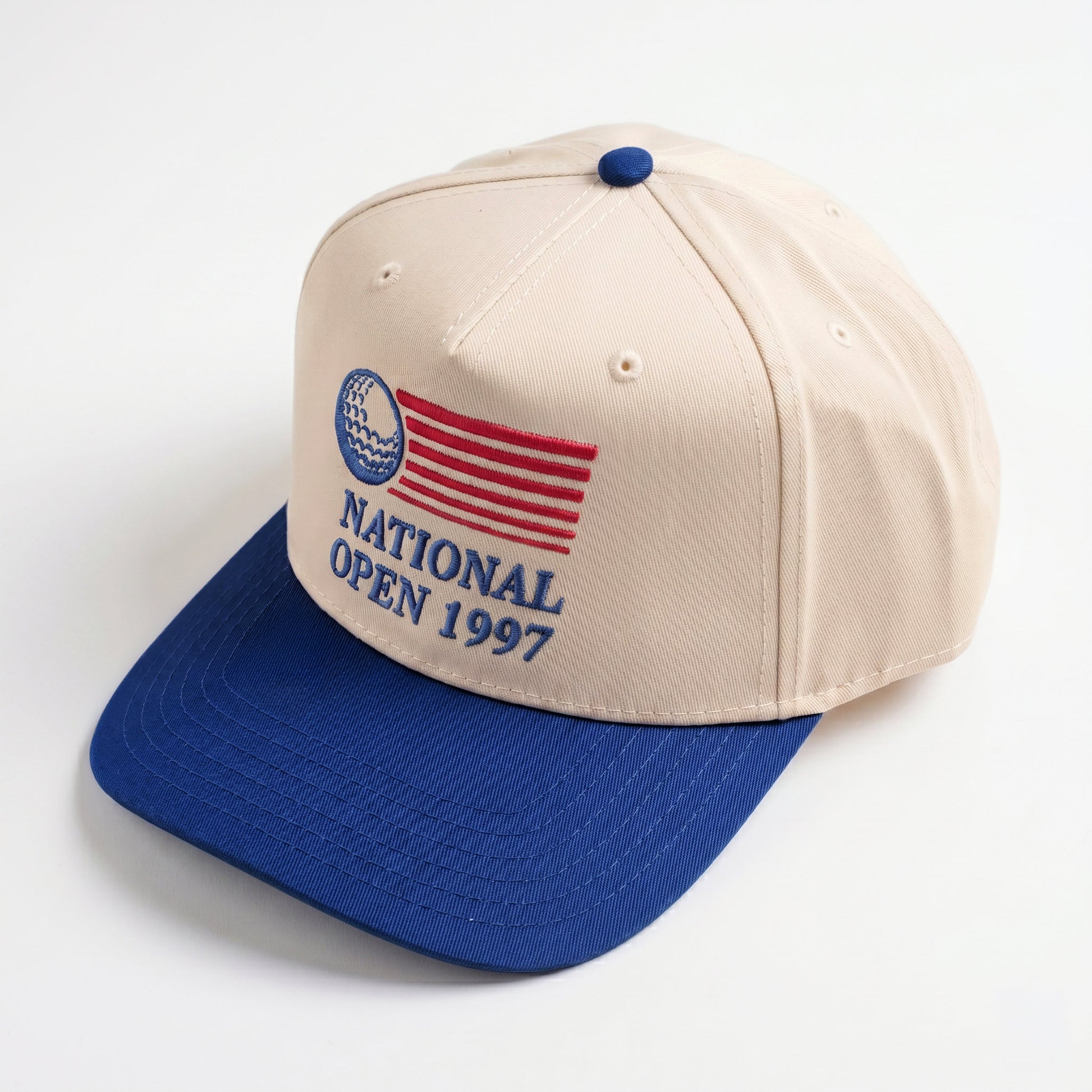 National Open 1997 golf hat in royal blue — three-quarter angle